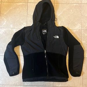 The North Face black fleece zip up jacket with hood. Womens size small.